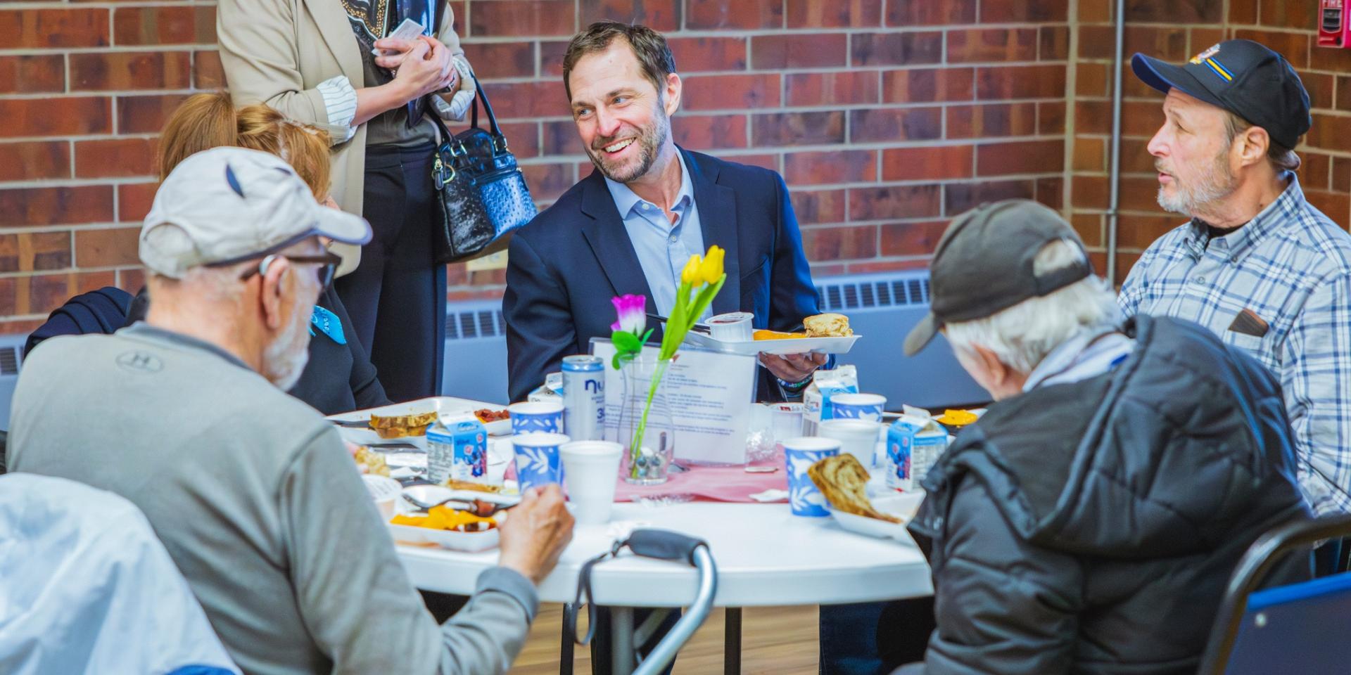 Rep. Crow having meal with constituents