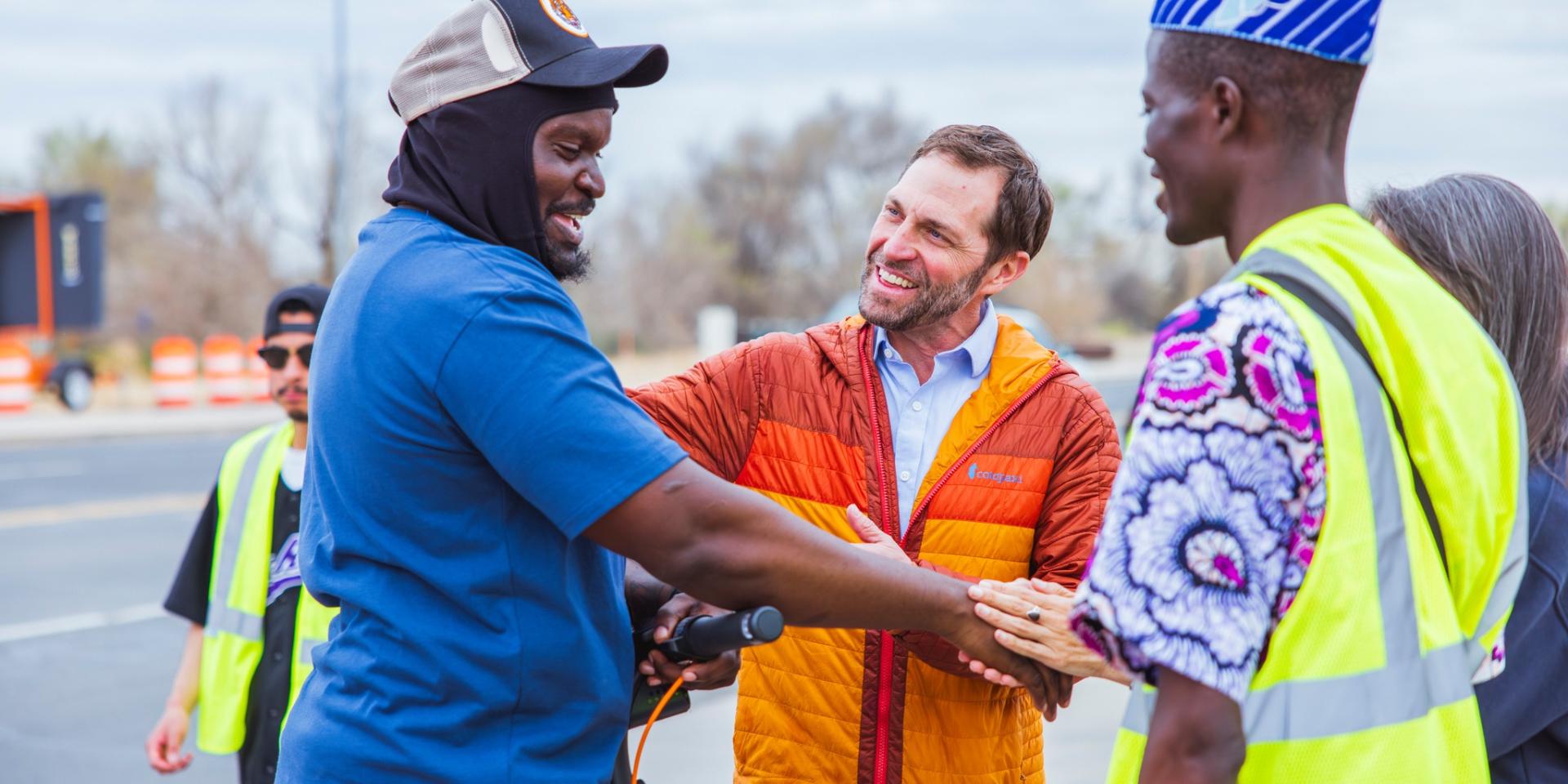 Rep. Crow shaking hands with people