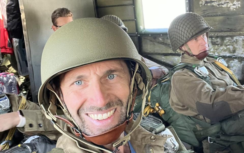 Rep. Crow prepares to re-enact the D-Day parachute jump over Normandy.