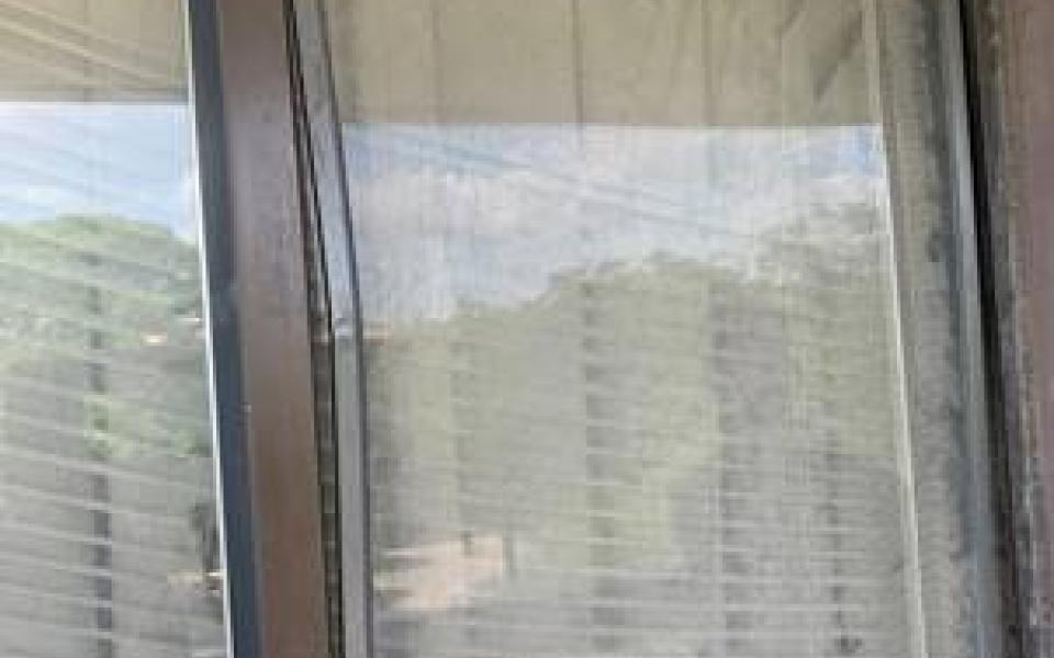 Photos taken by Rep. Jason Crow of poor conditions during post tour, including broken chairs in a classroom and occupied soldier housing