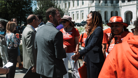 Rep. Crow and Tom Mauser with Moms Demand Action advocates.