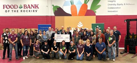 Rep. Crow with Food Bank of the Rockies President and CEO Erin Pulling, executive leadership, staff, and volunteers.