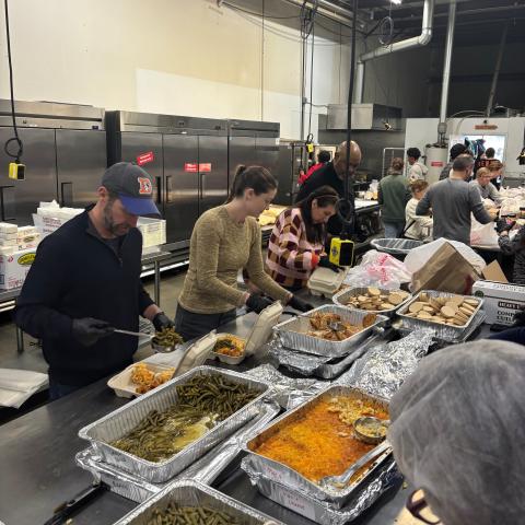 Congressman Crow helps prepare food on MLK Day