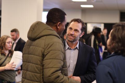 Congressman Crow speaks with an attendee of his annual job fair