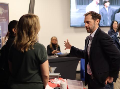 Congressman Crow speaks with employers at his annual job fair